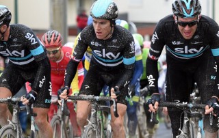 Geraint Thomas, Ian Stannard, and Ben Swift of Team Sky cycling in the rain