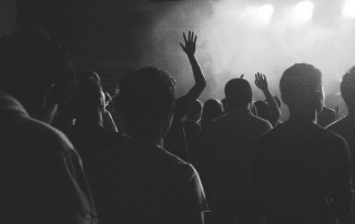 Crowd at a music concert in black and white