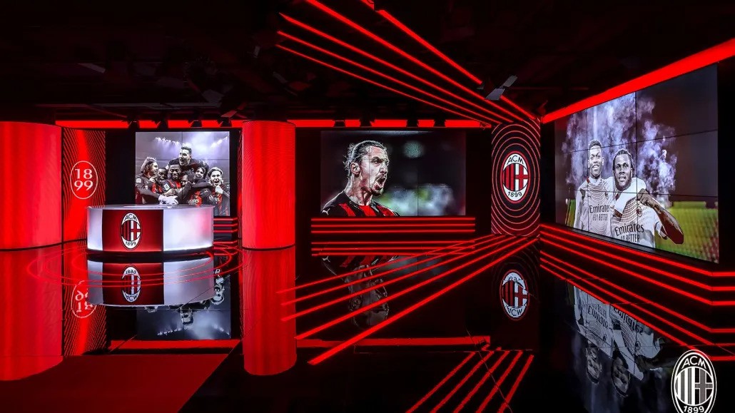 AC Milan TV studio with players pictured on TV screens