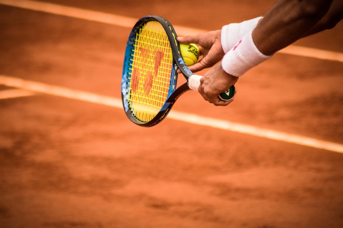 Yonex branding on tennis racket - women's sports sponsorship